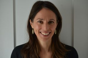 photo of a woman smiling against a white background